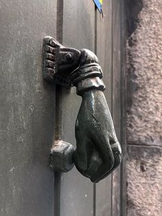 an old door handle with a bird on it