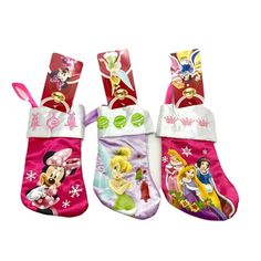 three christmas stockings with disney characters on them