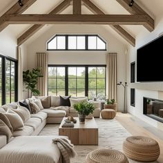 a living room filled with furniture and a flat screen tv mounted to the side of a wall