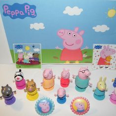 peppa pig figurines are lined up on a table