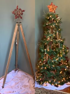 a christmas tree with lights on it next to a wooden tripod