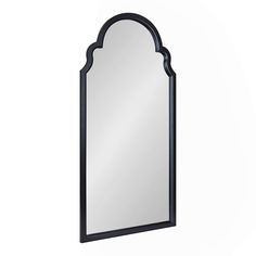 a mirror that is on the wall next to a white background with a black frame