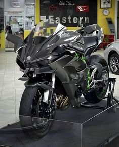 a futuristic motorcycle on display in a showroom