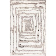 an abstract rug with white and grey stripes