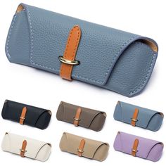 the leather case is lined with different colors and features a metal buckle on each side