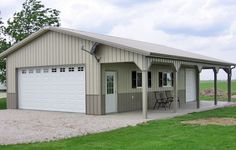 a two car garage sitting in the middle of a field