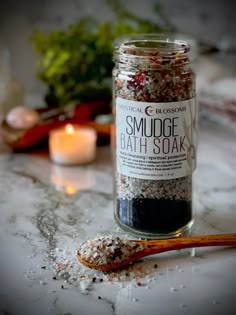 Our Smudge Bath Soak is a great way to cleanse and clear your aura. This soak includes palo santo, roses and hyssop botanicals. We blend the botanicals with black salt, Himalayan salt and epsom salt. The essential oils used are rose, frankincense, clove, holy basil & palo santo. 8 oz. | Packaged in an 8 ounce capacity reusable glass jar. INGREDIENTS | black salt, epsom salt, himalayan salt, rose petals, hyssop, white sage, palo santo, essential oils of: clove, rose, palo santo, holy basil and fr Bath Salts Packaging Ideas, Botanical Business, Bath Salts Diy, Black Salt, Herbal Bath, Spa Bath, Herbal Magic, Holy Basil, Homemade Bath Products