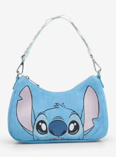 a blue purse with an image of stitching on the front and side, featuring a cartoon