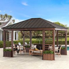 a gazebo sitting on top of a patio next to a swimming pool