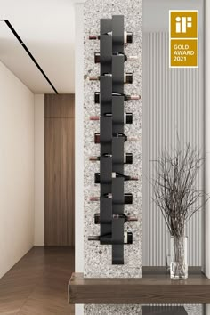 a wall mounted wine rack in the middle of a room with a vase on it