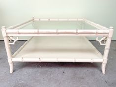 a white bamboo and glass coffee table