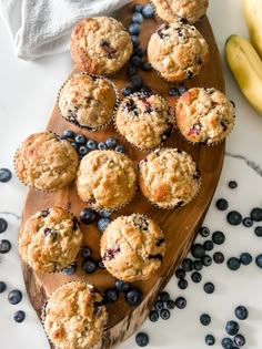 blueberry muffins on a cutting board with bananas