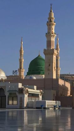 a large building with two green domes on top