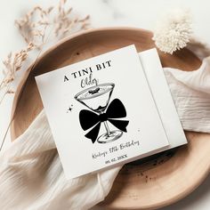 a tiny bit club greeting card with a bow tie and martini glass in it on a plate