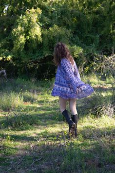 Our beautiful Sienna dress with its signature Blue Boheme silhouette and beautiful blue color is an unforgettable beauty and the ultimate bohemian glamour.Sizes: SM & ML100% Cotton | Color: Liberty BlueModel Height: 5'7Bust: 32BWaist: 24Hips: 32 Flowy Long Sleeve Boho Dress For Festival, Hippie Blue V-neck Dress, Hippie Style Flowy Tunic Dress, Bohemian Long Sleeve Mini Dress With Boho Print, Flowy Bohemian Purple Mini Dress, Flowy Purple Bohemian Mini Dress, Fall Festival Bohemian Boho Dress, Fall Festival Bohemian Dress, Blue Flowy Tunic Boho Dress