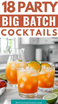 two glasses filled with orange and lime drink on top of a counter