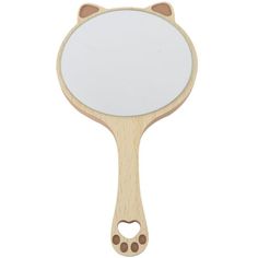 a wooden mirror with an animal face on it