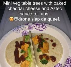 two tortillas on a plate with sauce and broccoli in the middle