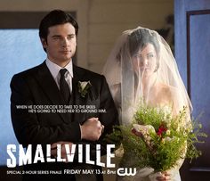 a man and woman standing next to each other in front of a poster for smallville