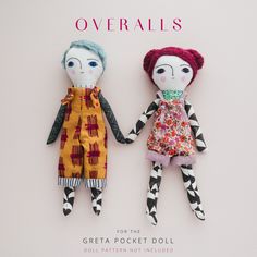 two handmade dolls sitting next to each other