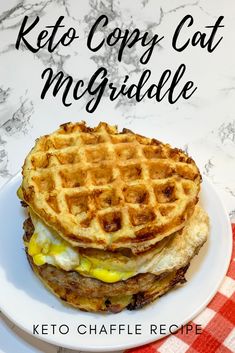 a white plate topped with a waffle sandwich