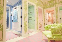 the bathroom is decorated in pastel green and pink colors with palm trees on the walls