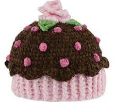 a knitted cupcake hat with pink and brown frosting