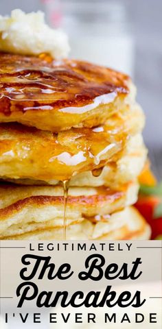 pancakes stacked on top of each other with syrup being drizzled over them