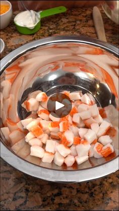 the food is being prepared and ready to be cooked in the bowl on the counter