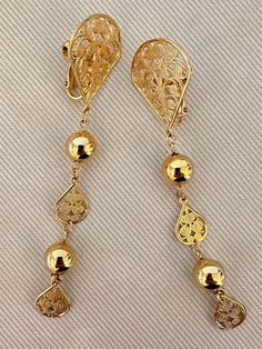 "Long NAPIER Filigree Dangle Clip On Statement Earrings c. 1960s -Gold tone finish  -Lightweight -Signed Napier  -Excellent vintage condition with age appropriate wear  -Size: 3 7/8\" long x 15/16\" wide -Clip ons" Mid-century Gold Earrings For Pierced Ears, Ornate Gold Clip-on Earrings For Evening, Ornate Gold Clip-on Earrings, Ornate Filigree Clip-on Earrings As Gift, Elegant Gold Clip-on Chandelier Earrings, Vintage Gold Filigree Clip-on Earrings, Black Tissue Paper, Cardboard Jewelry Boxes, Flower Clip