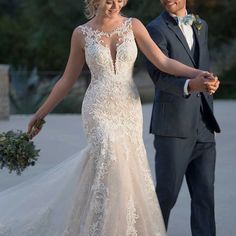 the bride and groom are walking together