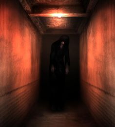 a ghostly man in a dark tunnel with red light coming from the ceiling and floor