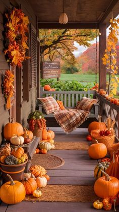 a porch covered in lots of pumpkins and squash