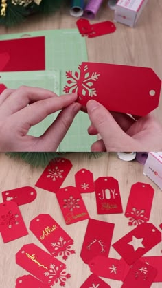 someone is cutting out some red paper with snowflakes on the top and bottom