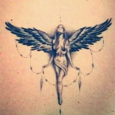 an angel tattoo on the back of a woman's upper body, with stars and circles around her