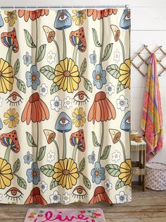 the shower curtain is decorated with colorful flowers