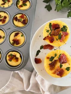 mini eggs with bacon and spinach on a plate next to muffin tins