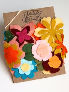 a package of felt flowers sitting on top of a table