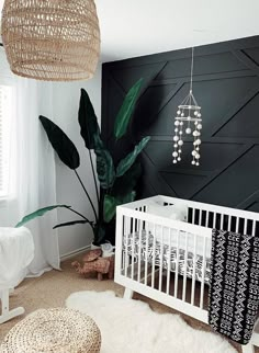 a baby's room decorated in black and white