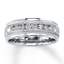 a white gold ring with diamonds on it