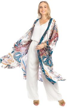 Love to layer all of your look in this bohemian-inspired duster that is covered in a bright medallion pattern. Open front Short sleeves 100% rayon Hand wash, line dry Imported Model stats: 5'10", 32" bust, 25" waist, 36" hip. Model is wearing size One Size. Bohemian Printed Summer Outerwear, Bohemian Long Printed Outerwear, Summer Bohemian Patterned Outerwear, Multicolor Bohemian Outerwear With Paisley Print, Bohemian Multicolor Paisley Print Outerwear, Bohemian Spring Outerwear With Paisley Print, Bohemian Outerwear With Paisley Print For Spring, Bohemian Patterned Beach Outerwear, Blue Bohemian Rayon Kimono