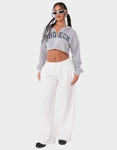 These Wide-Leg, Low-Rise Sweatpants Are The Ultimate Choice For A Cozy And Effortless Look. Perfect For Lounging Or Running Errands, Their Comfortable And Relaxed Fit Ensures You'll Feel Stylish And Comfortable All Day Long. Sweatpants. Low Rise Waist. Adjustable Waistband. Wide Leg. Model Wears Size S. Model Height Is 5'7. Item Care: Wash With Similar Colors. 50% Cotton, 50% Polyester. | Edikted Kamari Low Rise Wide Sweatpants White Cropped Pants For Fall, Low Rise Sweatpants, White Sweatpants, Grey Sweatpants, Womens Sweatpants, Low Waisted, Low Rise, Wide Leg, Sweatpants