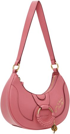 LWG-certified grained goatskin shoulder bag in pink. · Detachable shoulder strap · Logo and text embossed at face · O-ring, braided leather trim, and logo charms · Zip closure · Cotton twill lining · H6 x W9 x D2.5 Supplier color: Pushy pink Pretty Bags, Chloe Bag, See By Chloe, Braided Leather, Half Moon, Pink Bag, O Ring, Leather Trim, Leather Trims