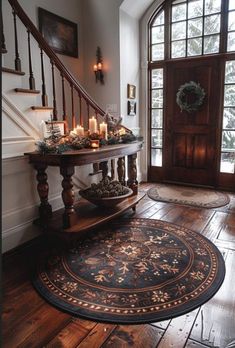 the entryway is decorated with candles and wreaths