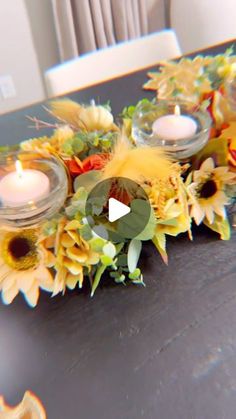 sunflowers and candles are arranged on a table