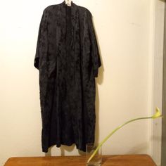 Pure Silk Robe. Black Floral Jacquard. Side Pockets. Open Front. No Belt. Gvc, Spotted Three Tiny Holes In The Back When Photographing Against The White Wall - See Close Up Photos. Please Note, Camera Brightening Was Used In Some Photos To Better Capture Details. Vintage Golden Deer 100% Pure Silk One Size True Maxi/Duster; Approximately 52" Long From Center Back Neck To Hem. Silk Robes Dusters| Natural Fabrics Materials| Dramatic| Goth| Dark Romance Romantic| Noir| Femme Fatal| Glamorous| All S Dark Romantic, Romantic Colors, Silk Robe, Sleepwear Robe, Natural Fabrics, Black Floral, Women's Intimates, Vintage Black, Vintage Ladies