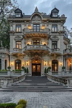 an ornately decorated house with steps leading up to the front door