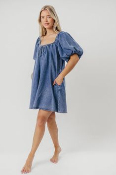 The Morgan Mini Dress is a summer essential -- she's quirky, on-trend, and (thanks to her 100% cotton construction), incredibly comfortable. We love how easy it is to dress this mini up with wedges and accessories, or dress it down with tennies or slides for a day of shopping or sightseeing. You don't want to miss out on this unique addition to your closet! FIT: Runs true to size - relaxed fit. MATERIAL: 100% Cotton. GARMENT DETAILS: Cotton denim mini dress with a swing silhouette and square, el Washed Blue Cotton Mini Dress, Denim Tie, Fam Pics, Babydoll Mini Dress, The Morgan, Garment Details, Summer Essential, Denim Mini Dress, Tie Dress