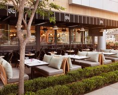 an outdoor dining area with tables and chairs