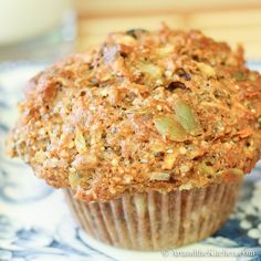 a muffin sitting on top of a blue and white plate